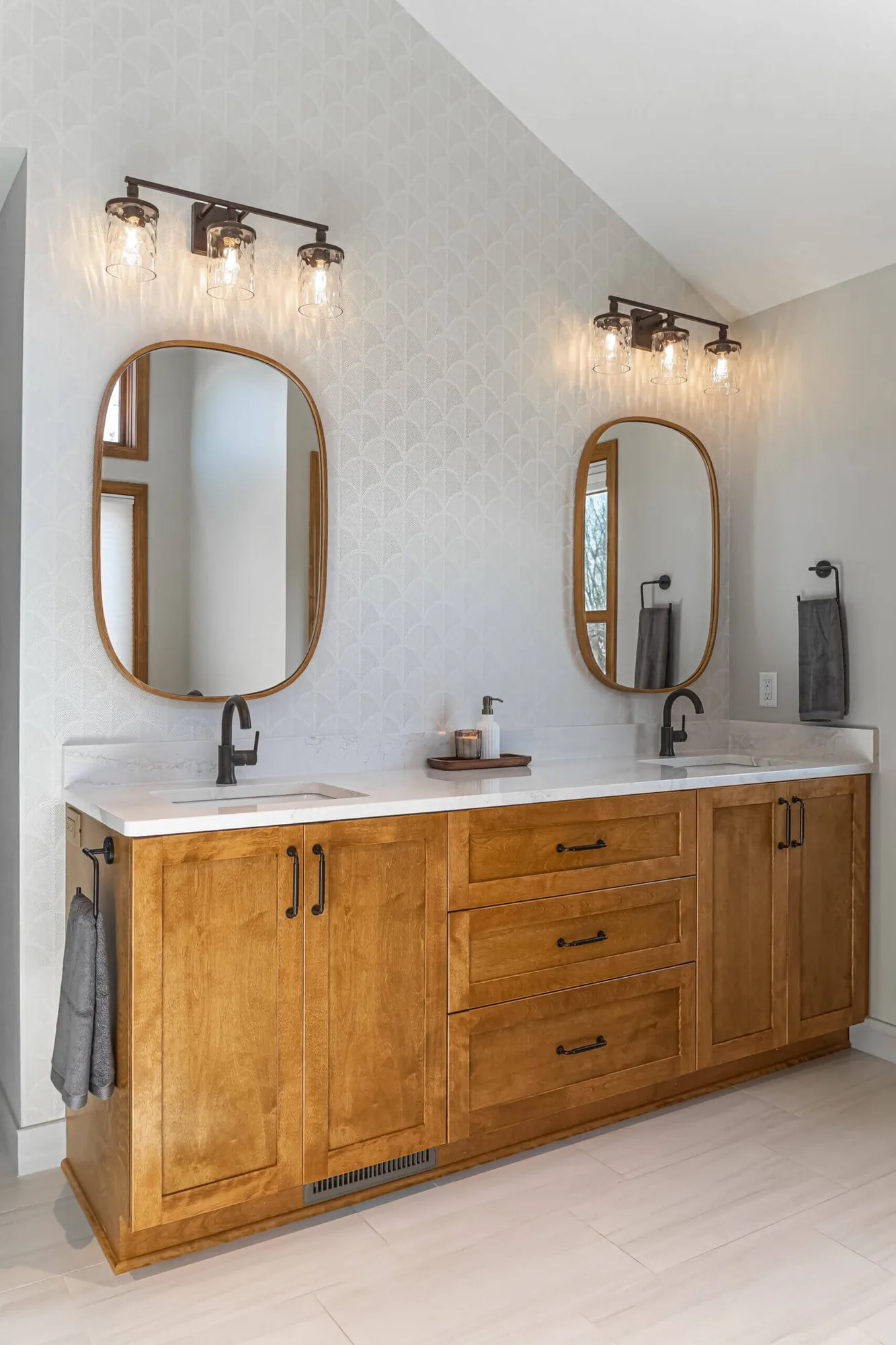 Bathroom vanity in quarter sawn oak with twin sinks and arched mirrors